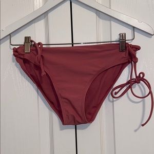 Dusty rose colored swim bottoms with side tie